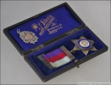 A silver hallmarked enamel masonic medal and ribbon from the Queen Alexandria Lodge - RAOB Primo