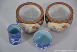 A pair of Chinese miniature carp bowls,
