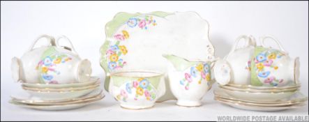 A Royal Albert hand painted floral Art Deco tea service consisting of trio's,