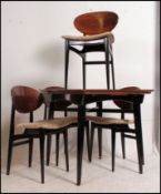 A vintage / retro mid 20th century draw leaf table with four matching butterfly panel back chairs