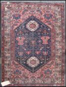A Persian Quchan prayer rug being handknotted of wool construction having central mihrab geometric
