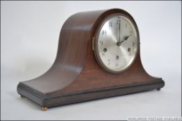 A 1930's napoleons hat mantel clock with silvered dial,