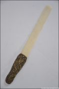 A 19th century Japanese bronze and bone page turner,