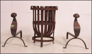 A large pair of Victorian Arts & Crafts cast iron fire dogs - andirons each with ball finials