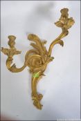 Rococo style gilded brass candelabra wall sconce. Measure: 54cms long.