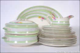 A vintage 20th century Palissy art deco hand painted dinner service to include tureens,