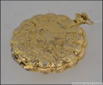 A decorative 20th century ladies compact in gilded metal case with decorative bird scene,