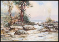 Bartram Hiles (1872-1927) England. A snow swept winter country scene with trees and rocks.