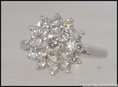 An 18ct white gold and diamond cluster r