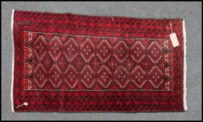 A Persian Balchestan hand knotted rug ha