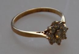 A 9ct gold diamond cluster daisy ring ap