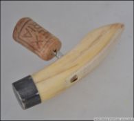 A silver Kenyan warthog tusk and silver