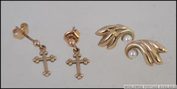 A pair of 375 - 9ct gold earrings in the
