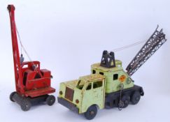 CRANES: Two vintage tinplate toy cranes.