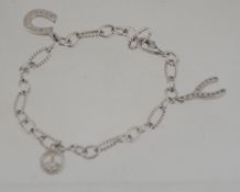 A 925 silver charm bracelet with lucky horseshoe,