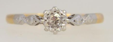 An 18ct gold and platinum vintage ladies ring having central claw illustion set diamond approx