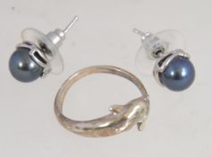 A silver 925 ladies dress ring in the form of a dolphin together with a silver pair of pearl stud