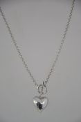 A contemporary silver 925 ladies necklace chain with heart pendant having bar and hoop clasp.