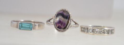 A collection of 3silver rings to include channel set,