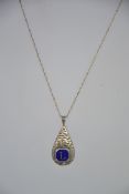 A silver rope linked necklace chain having an enamel set pear drop pendant with enamel roundel