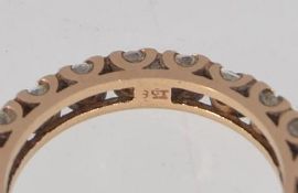 A tested 9ct gold full eternity ring with clear stones in a cup setting Marked 9ct. Weight 2.8g.