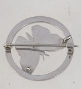A vintage 925 silver and marcasite brooch pin in the form a butterfly within a roundel with C clip