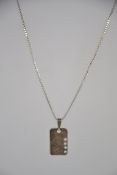 A silver box linked chain having a modernist pierced pendant. Total weight 6.