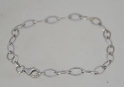 A contemporary silver bracelet made in the form of ovals having lobster claw clasp. Weight 3.