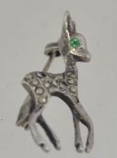 A vintage silver brooch in the form of a deer - bambi having garnet stone eyes and pin back.