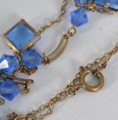 A vintage rolled gold drop pendant necklace with faceted drops with spring hoop clasp.