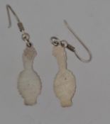 A pair of white metal drop earrings with cat motif drop pendants and fish hook fasteners.