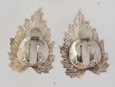 A pair of vintage 925 silver clip on earrings in leaf form. Marked Sterling Silver. Measures 2.