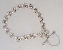 A good silver rolo- belcher linked bracelet with heart pendant . 20cms long. weight 20.