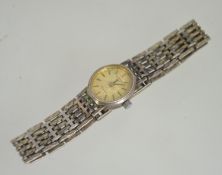 A good Rotary ladies silver hallmarked wristwatch and silver bracelet. The face with baton numerals.