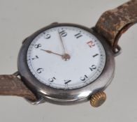 A silver vintage wristwatch with enamel set face having leather strap. The face with faceted hands.