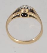 A vintage hallmarked Birmingham 9ct gold ring with central sapphire surrounded by illusion set