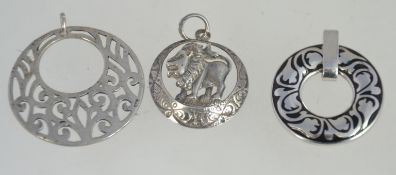 A colection of 3 silver necklace pendants all of roundel form to include Lion,