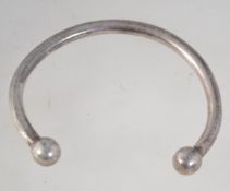A heavy 925 silver cuff bangle bracelet with ball finial decoration. Marked 925. Weight 35g.