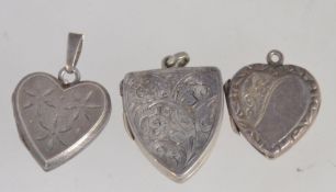 A collection of 3 silver heart shaped lockets to include Birmingham hallmarked locket and 2