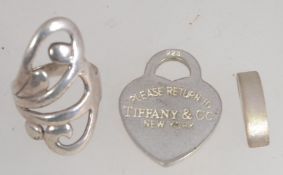 A silver rococo dress ring of large form ( length 3cms) together with a contemporary silver