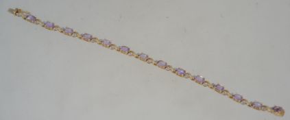 A 9ct gold, diamond and amethyst ladies bracelet.