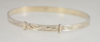 A silver rococo chased expanding bracelet marked silver. Weight 6.