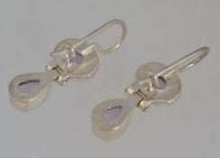 A pair of 925 articulating drop earrings set with amethyst. Marked 925. Measures 3cms.