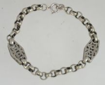 A silver 925 rolo linked bracelet with fret pierced spacers of star design and hexagonal form with