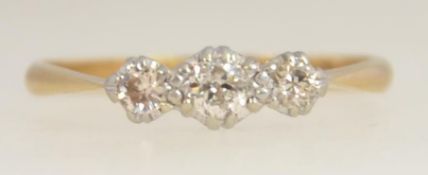 An 18ct gold and platinum vintage ladies ring by T&B. The stones approx 20pnts. Size M / Weight 1.