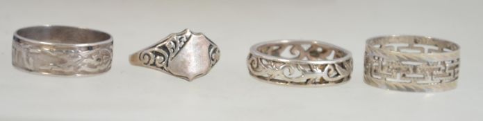 3 silver eternity rings, one with greek ket lattice work design,