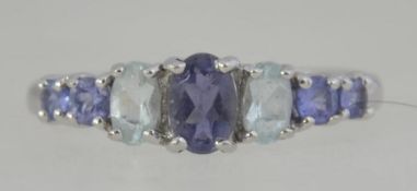 A 9ct white gold / 375 marked amethyst and clear stone ladies dress ring.