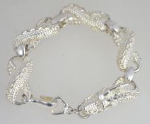 A silver white metal marked 925 oversized bracelet in the form of a highly detailed Chinese dragon.