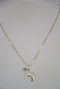 A silver box linked and lakeland terrier silver necklace pendant. The chain with c-clasp.