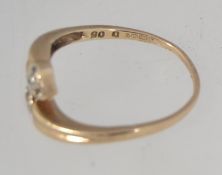 A vintage hallmarked Sheffield 9ct gold cross over ring with diamond set heart shaped finials and
